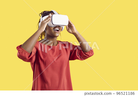 Smiling black woman in vr glasses enjoy new technologies Smiling black woman in vr glasses enjoy new technologies 96521186