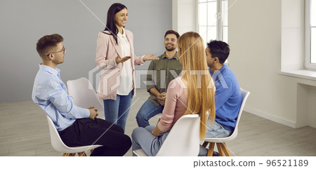 Smiling woman speak with employees at casual meeting 96521189