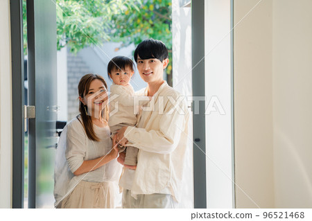 Young family going out with baby 96521468