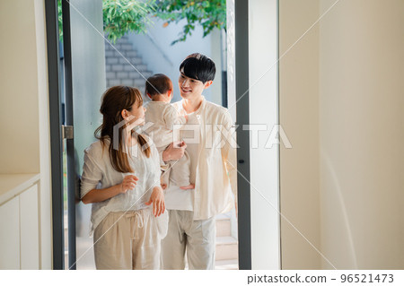 Young family going out with baby 96521473