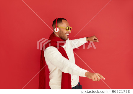 Winter Man Listening Music. Positive Multiracial Man Listening Song Headphones 96521758