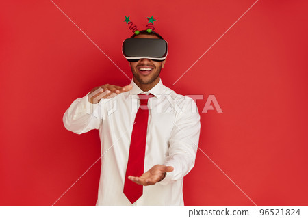 Positive VR Man Showing Size. Portrait of Guy Wearing Virtual Reality Headset Positive VR Man Showing Size. Portrait of Guy Wearing Virtual Reality Headset 96521824