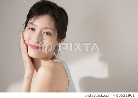 A middle-aged woman who does skin care 96521961