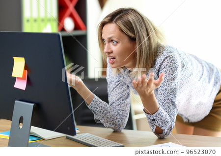 Financial problem, unexpected results, lack of money. Confused and stressed woman looking at computer screen. Financial problem, unexpected results, lack of money. Confused and stressed woman looking at computer screen. 96523070