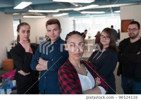 Portrait of a successful creative business team looking at camera and smiling. Diverse business people standing together at startup. 96524116