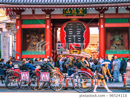 Tokyo cityscape in Japan: Sensoji Temple bustling with foreign tourists. Foreigners sightseeing on rickshaws…=November 16 Tokyo cityscape in Japan: Sensoji Temple bustling with foreign tourists. Foreigners sightseeing on rickshaws…=November 16 96524118
