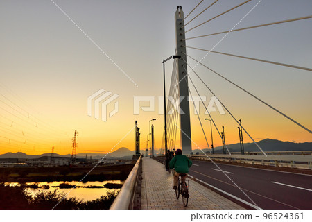 Mt.Fuji at sunset seen from Ginga Bridge over Sagami River 96524361
