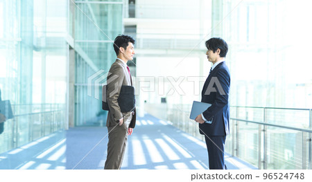 Cool businessman in his 30s-40s wearing a suit Cool businessman in his 30s-40s wearing a suit 96524748