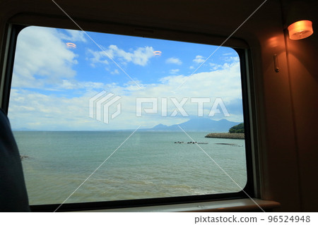 View of the Ariake Sea from a train on the Nagasaki Main Line with a view of Unzen 96524948