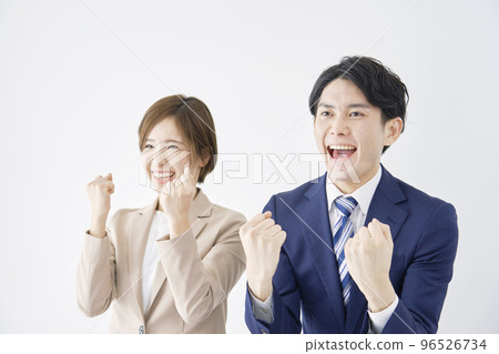 Business woman and businessman in a guts pose white background 96526734