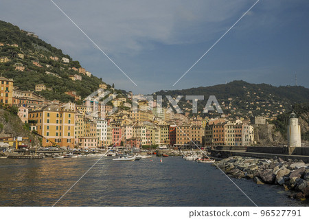 Camogli typical village with colorful houses and small harbor in Italy, Liguria in a sunny day view from the boat Camogli typical village with colorful houses and small harbor in Italy, Liguria in a sunny day view from the boat 96527791