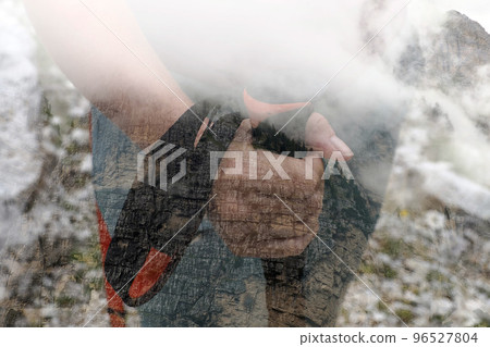 Trekking in Dolomites mountains on a cloudy day double exposure image idea concept Trekking in Dolomites mountains on a cloudy day double exposure image idea concept 96527804