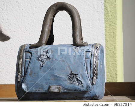 blue female bag sculpture detail blue female bag sculpture detail 96527814
