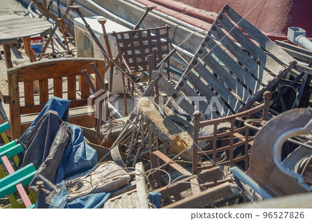 many abandoned old chairs junk 96527826