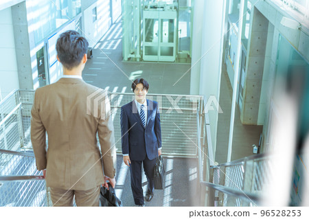 Cool businessman in his 30s-40s wearing a suit Cool businessman in his 30s-40s wearing a suit 96528253