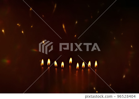 Religious image of Jewish holiday Hanukkah with candles of menorah with sparks from the fire in the air Religious image of Jewish holiday Hanukkah with candles of menorah with sparks from the fire in the air 96528404