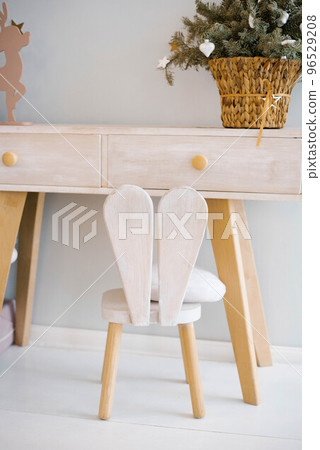 High chair made of wood with Bunny ears in the children's room 96529208