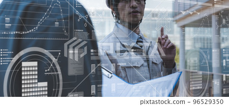 A man in his thirties wearing work clothes 96529350