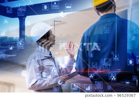 A man in his thirties wearing work clothes 96529367