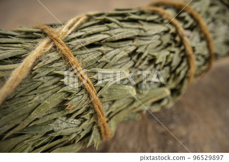 closeup of cedar incense bundle 96529897