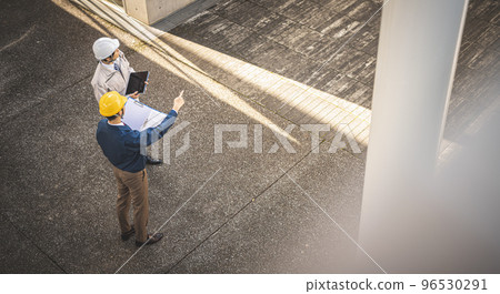 A man in his thirties wearing work clothes A man in his thirties wearing work clothes 96530291