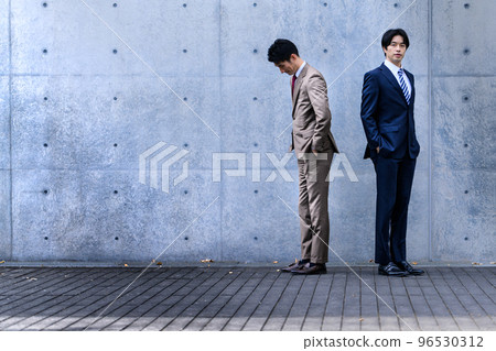 Cool businessman in his 30s-40s wearing a suit Cool businessman in his 30s-40s wearing a suit 96530312