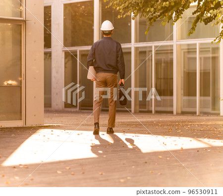 Business person doing inspection work Business person doing inspection work 96530911