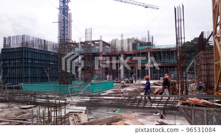 MELAKA, MALAYSIA - MARCH 4, 2021: The building structure is made of reinforced concrete still under construction. This reinforced concrete mold is made of timber and plywood formwork. MELAKA, MALAYSIA - MARCH 4, 2021: The building structure is made of reinforced concrete still under construction. This reinforced concrete mold is made of timber and plywood formwork. 96531084