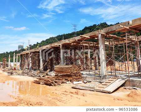 MELAKA, MALAYSIA - MARCH 4, 2021: The building structure is made of reinforced concrete still under construction. This reinforced concrete mold is made of timber and plywood formwork. 96531086
