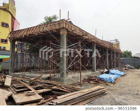 MELAKA, MALAYSIA - MARCH 4, 2021: The building structure is made of reinforced concrete still under construction. This reinforced concrete mold is made of timber and plywood formwork. 96531096