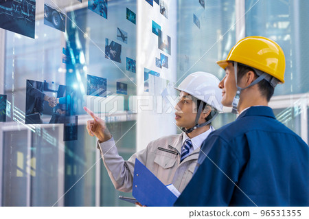 A man in his thirties wearing work clothes A man in his thirties wearing work clothes 96531355