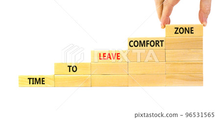 Leave comfort zone symbol. Concept words Time to leave comfort zone on wooden blocks. Businessman hand. Beautiful white background. Business time to leave comfort zone concept. Copy space. 96531565