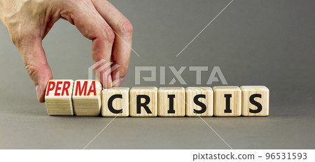 Permacrisis or crisis symbol. Concept words Crisis and Permacrisis on wooden cubes. Businessman hand. Beautiful grey table grey background. Business permacrisis or crisis concept. Copy space. Permacrisis or crisis symbol. Concept words Crisis and Permacrisis on wooden cubes. Businessman hand. Beautiful grey table grey background. Business permacrisis or crisis concept. Copy space. 96531593