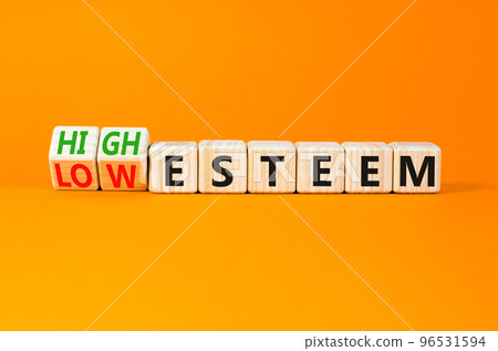 High or low esteem symbol. Concept words High esteem and Low esteem on wooden cubes. Beautiful orange table orange background. Business high or low esteem concept. Copy space. High or low esteem symbol. Concept words High esteem and Low esteem on wooden cubes. Beautiful orange table orange background. Business high or low esteem concept. Copy space. 96531594