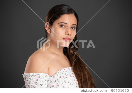 Portrait of latin girl with piercing in ear Portrait of latin girl with piercing in ear 96531630