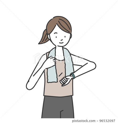 Woman in training checking her smartwatch 96532097