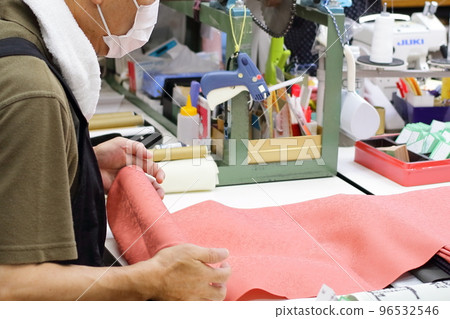 Craftsmen checking kimono rolls in the workshop Craftsmen checking kimono rolls in the workshop 96532546