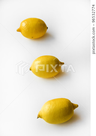 Yellow ripe lemon on a white background. Juicy lemons close-up. Isolate of the fruit of a yellow lemon. 96532774