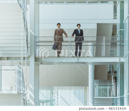 Cool businessman in his 30s-40s wearing a suit Cool businessman in his 30s-40s wearing a suit 96533434