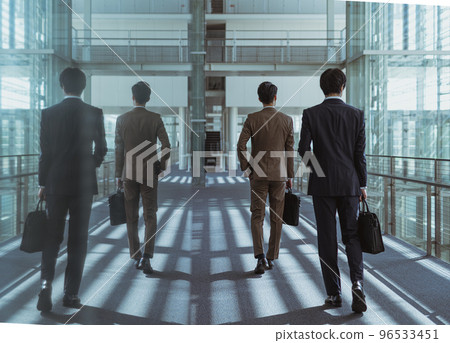 Cool businessman in his 30s-40s wearing a suit Cool businessman in his 30s-40s wearing a suit 96533451