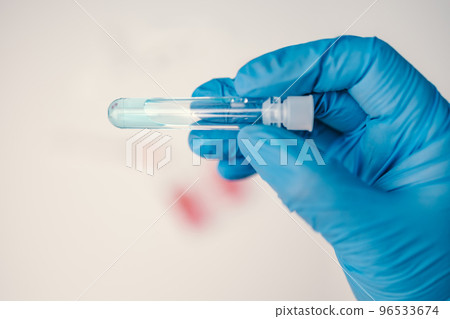 A laboratory employee taking sample PCR microtubes with cotton swab test. Diagnostic testing for COVID-19. The concept of the diagnosis of viral diseases. 96533674