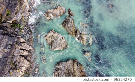 A lot of boulders in the sea. Coastal cliffs of the North Atlantic. Seaside beautiful nature. Dramatic seascape of the north of Europe. Drone point of view. A lot of boulders in the sea. Coastal cliffs of the North Atlantic. Seaside beautiful nature. Dramatic seascape of the north of Europe. Drone point of view. 96534270