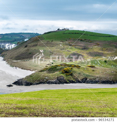 Picturesque hills in the south of Ireland, a view of the Clonakilty seashore. Cloudy, rainy weather. Landscapes along the Wild Atlantic Way. Picturesque hills in the south of Ireland, a view of the Clonakilty seashore. Cloudy, rainy weather. Landscapes along the Wild Atlantic Way. 96534271