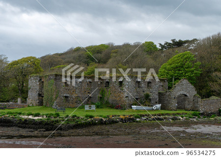The Arundel grain store, shore of Clonakilty Bay. An stone building. Historical monument, landscape. Tourist attractions in Ireland The Arundel grain store, shore of Clonakilty Bay. An stone building. Historical monument, landscape. Tourist attractions in Ireland 96534275