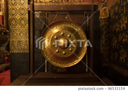 A huge nipple gong in Wat Xieng Thong temple in Luang Prabang, Laos A huge nipple gong in Wat Xieng Thong temple in Luang Prabang, Laos 96535159