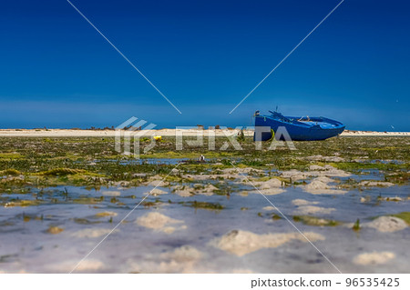 Beautiful view of the boat in the bay of the Mediterranean Sea at low tide on the island of Djerba, Tunisia 96535425