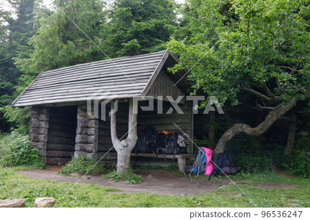Wooden  shed , refuge for tourists in case of bad weather, on a summer foggy day, Jesenik mountains 96536247