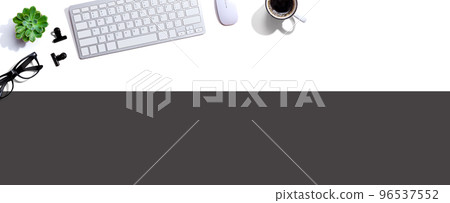 Computer keyboard with a cup of coffee and eyeglasses 96537552