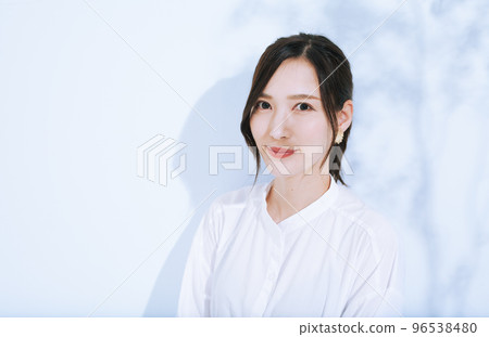 young woman in white shirt 96538480