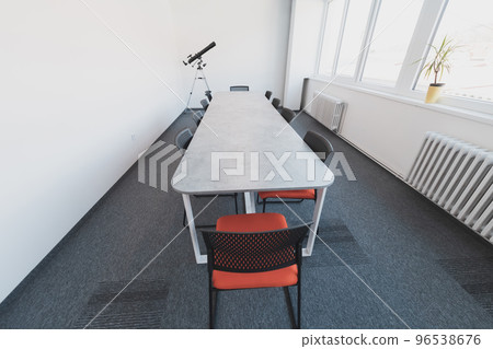 Photo of a modern office where programming, digital marketing and web design projects are done. Office with modern furniture and glass office Photo of a modern office where programming, digital marketing and web design projects are done. Office with modern furniture and glass office 96538676